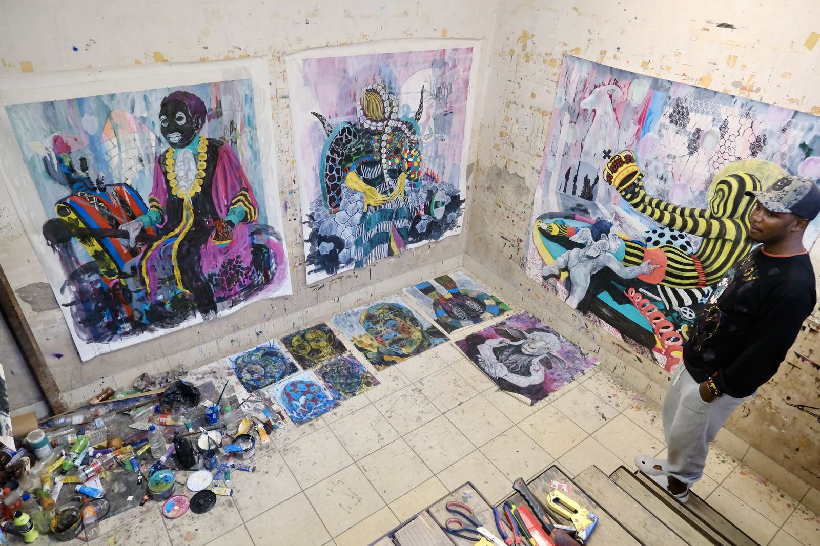 Evans Mutenga’s studio, a basement room with murals, December 2024.
